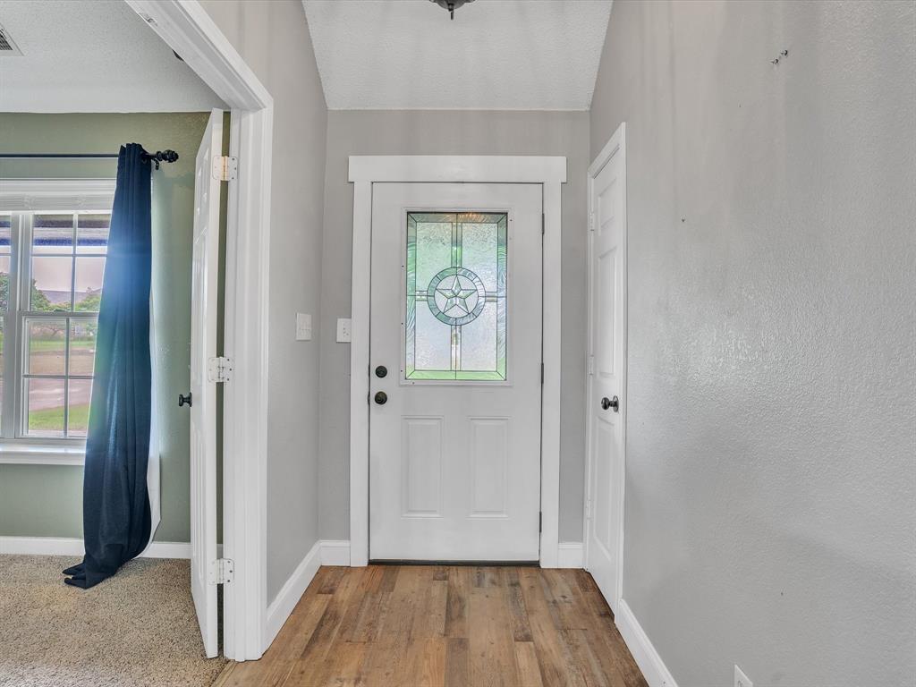 15067 Meadow Ridge Court Nevada, TX 75173 - Photo 7 of 39 wooden floor in an empty room