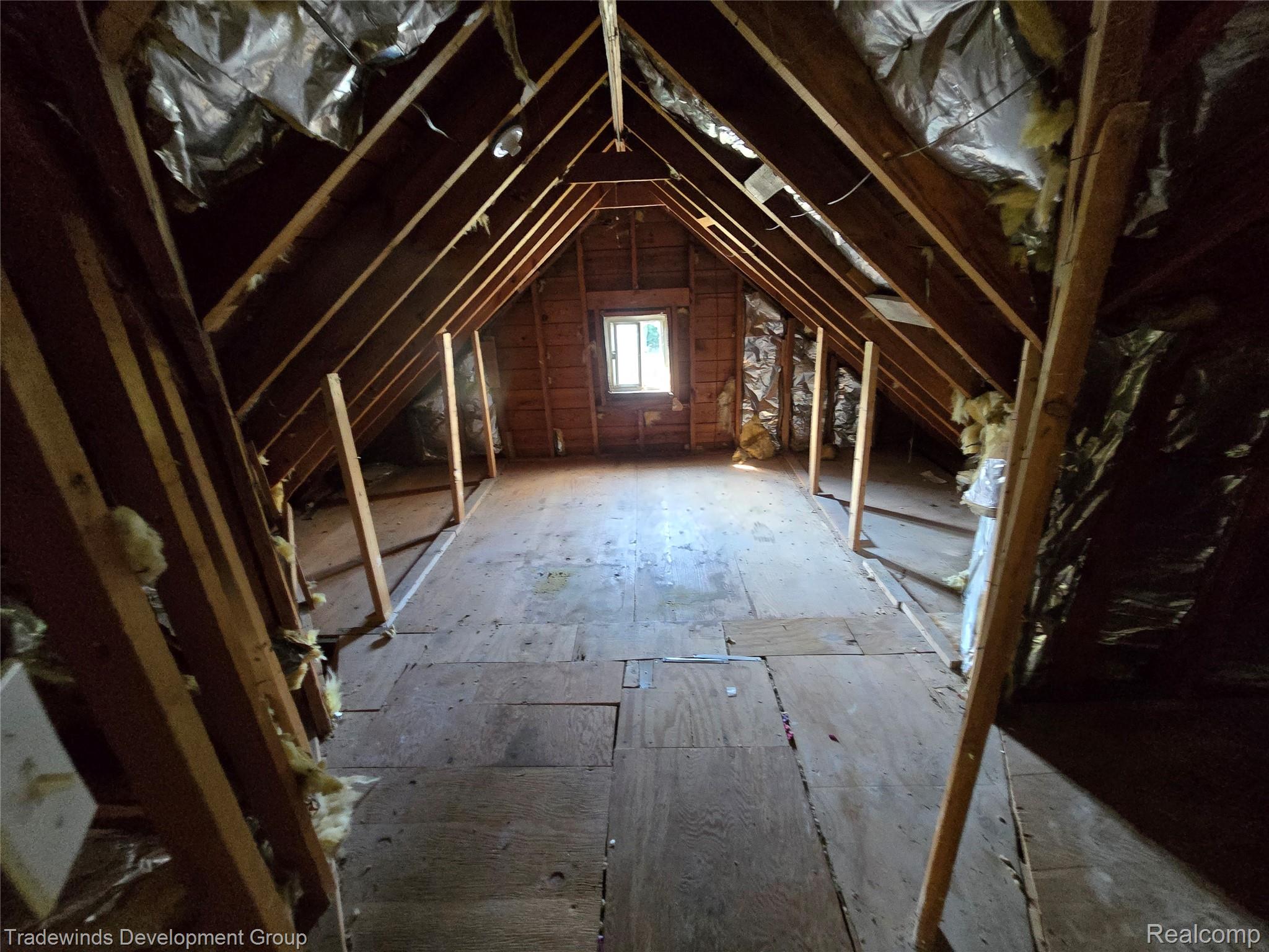 10742 Balfour Road Detroit, MI 48224 - Photo 15 of 16 Attic space featuring exposed wood rafter system and partial insulation