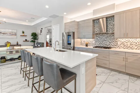 an aerial view of a golf course with swimming pool and green space