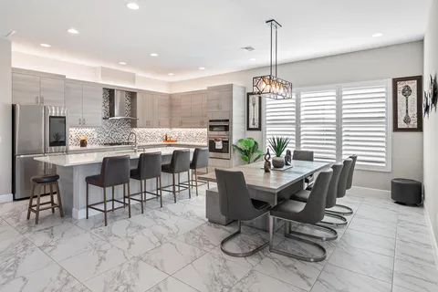 a view of a big building with a big yard and plants