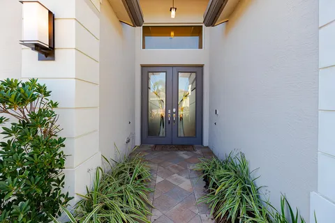 a kitchen with a sink a counter space appliances and a window