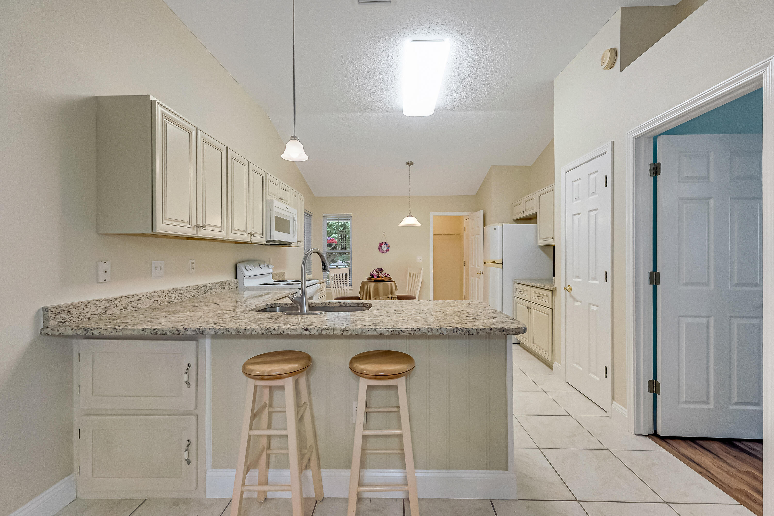 4730 Connor Drive Crestview, FL 32539 - Photo 16 of 71 a kitchen with stainless steel appliances granite countertop a sink and cabinets