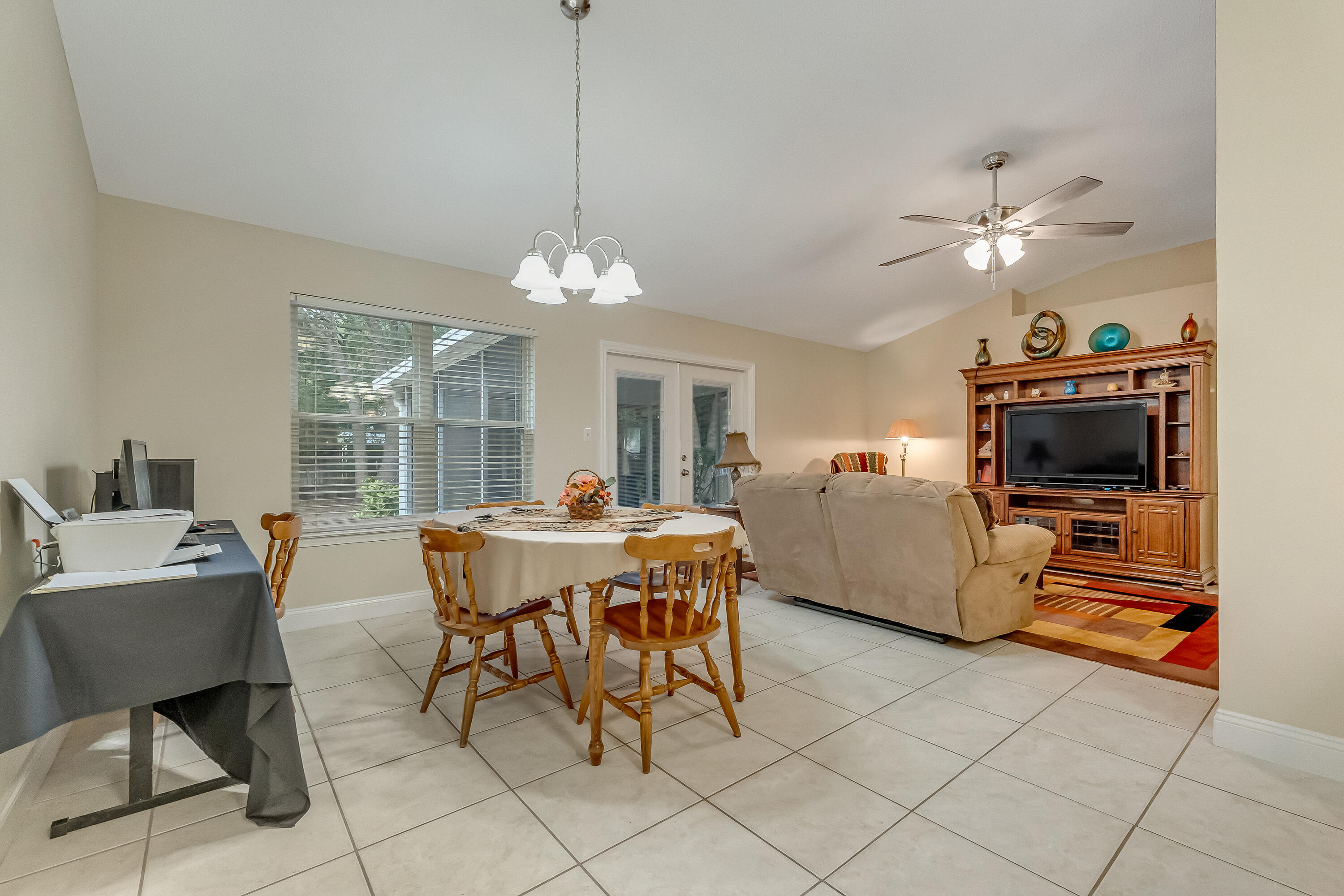 4730 Connor Drive Crestview, FL 32539 - Photo 18 of 71 a living room with furniture and a chandelier