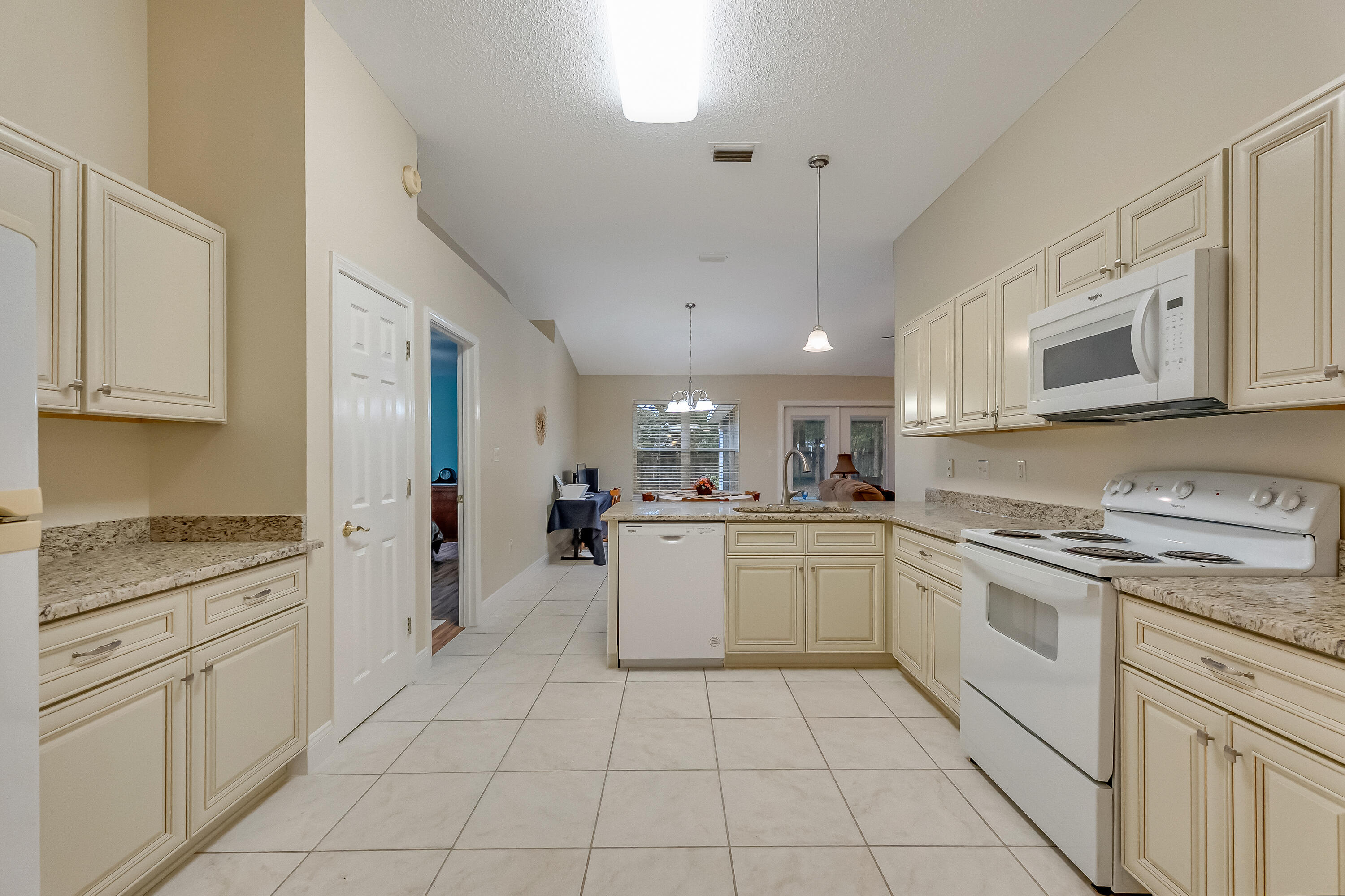 4730 Connor Drive Crestview, FL 32539 - Photo 28 of 71 a kitchen with a stove top oven sink and cabinets