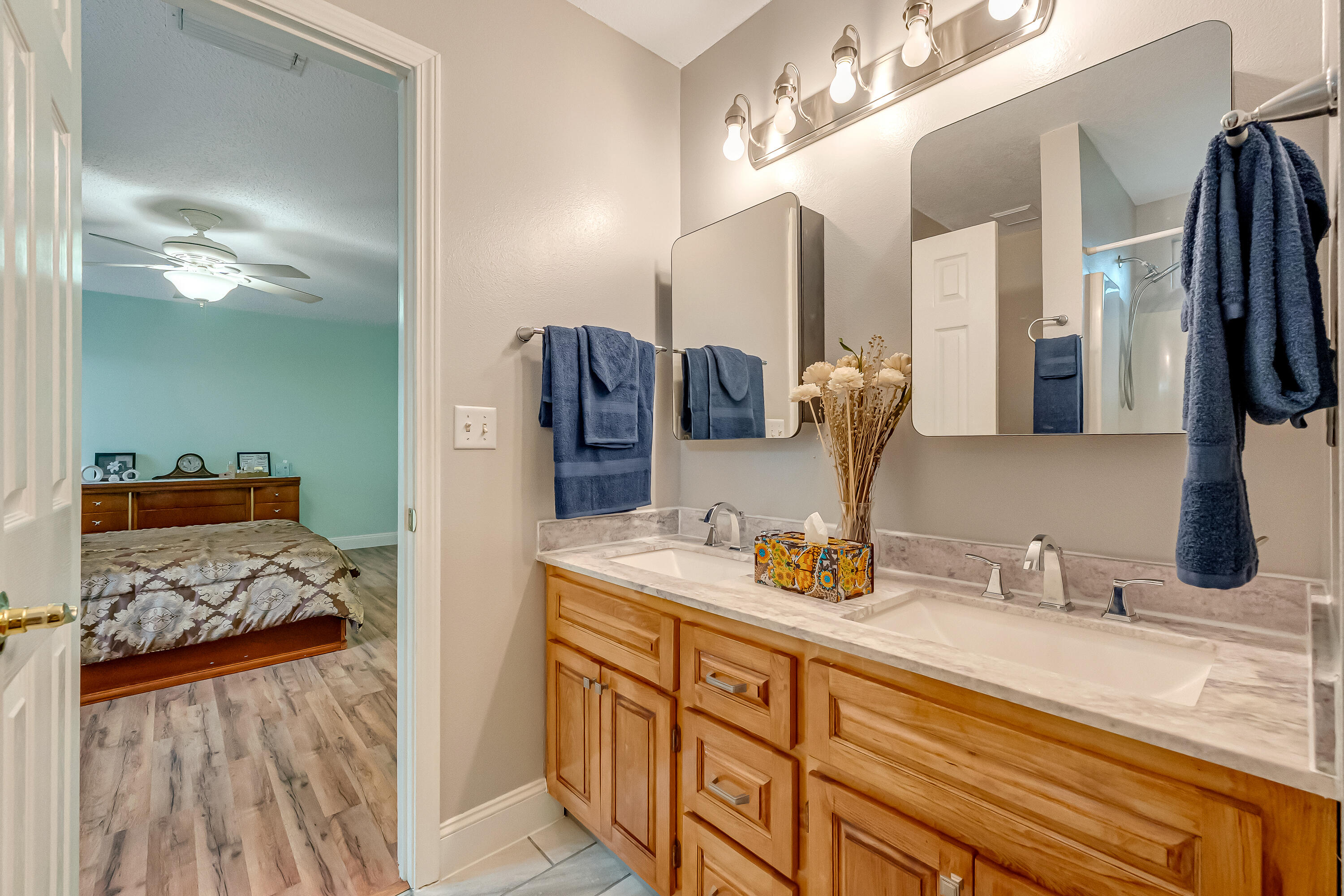 4730 Connor Drive Crestview, FL 32539 - Photo 33 of 71 a bathroom with a double vanity sink and a mirror