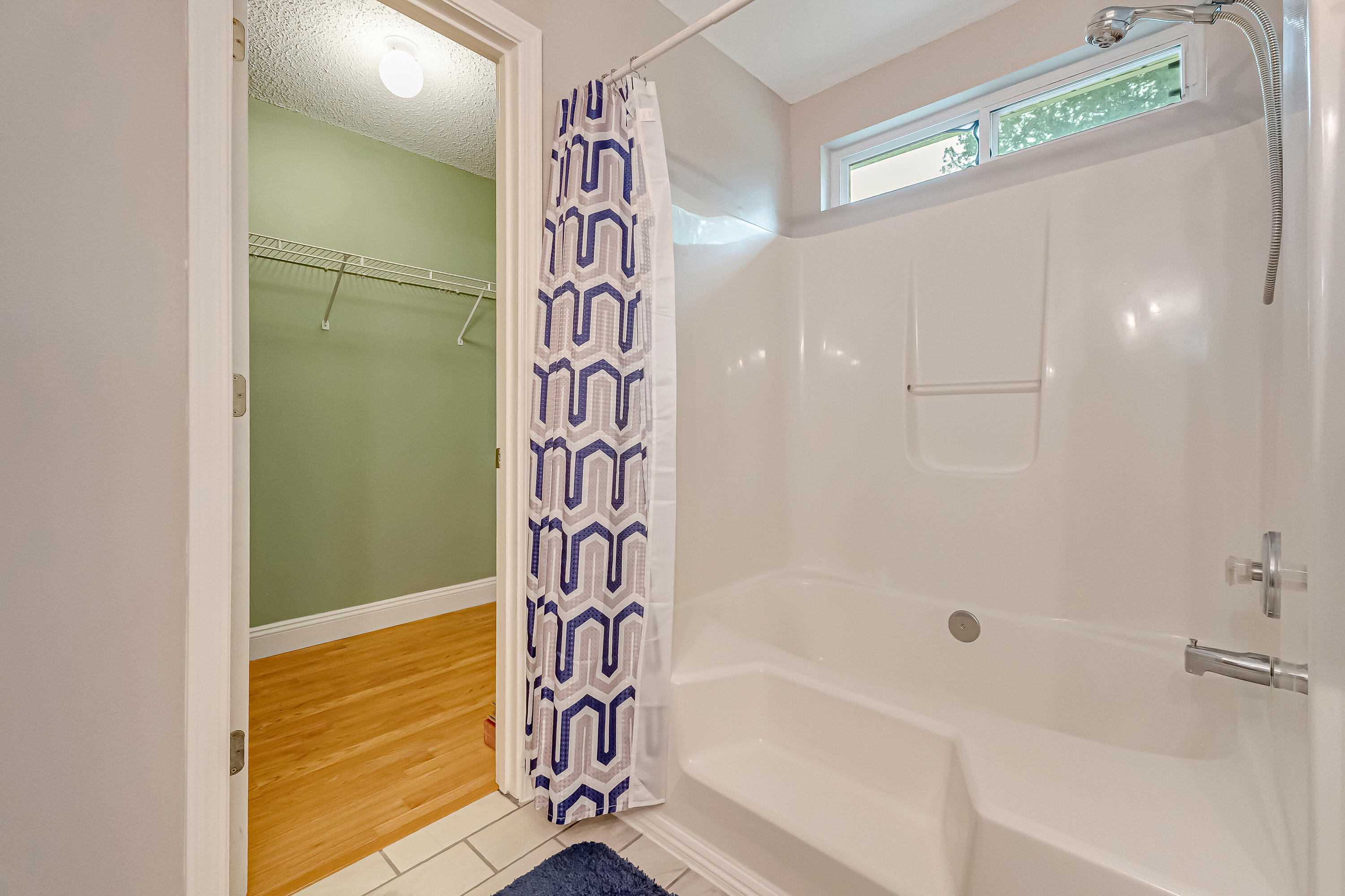 4730 Connor Drive Crestview, FL 32539 - Photo 34 of 71 a bathroom with a bathtub and shower