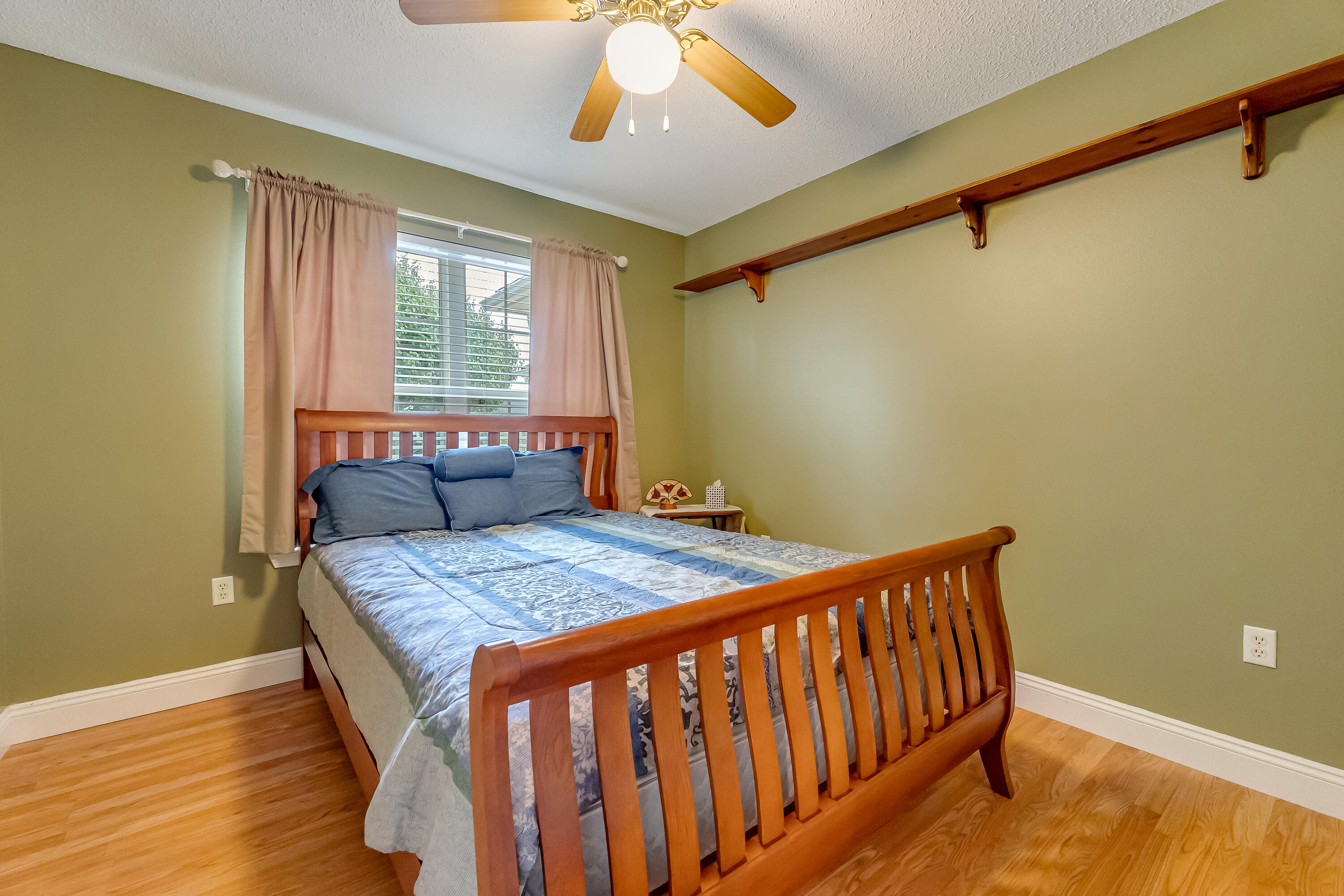 4730 Connor Drive Crestview, FL 32539 - Photo 39 of 71 a bedroom with a bed and a chandelier