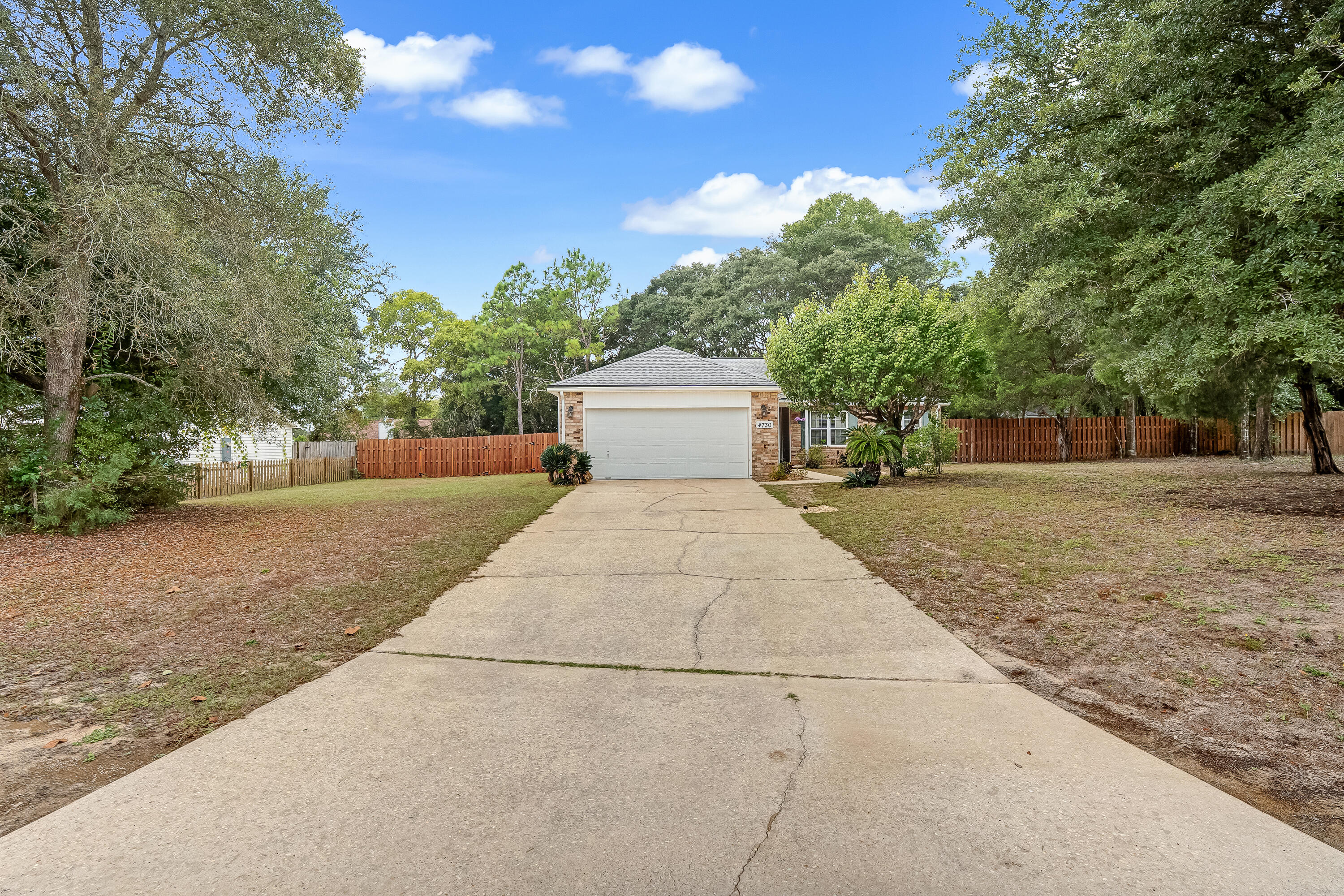 4730 Connor Drive Crestview, FL 32539 - Photo 4 of 71 a view of a yard with potted plants