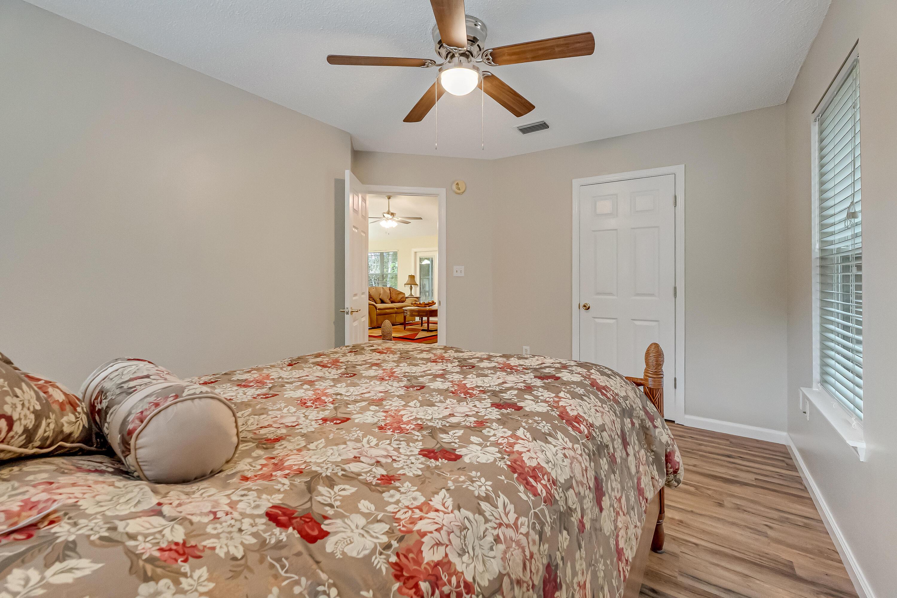 4730 Connor Drive Crestview, FL 32539 - Photo 42 of 71 a bedroom with a bed and a chandelier