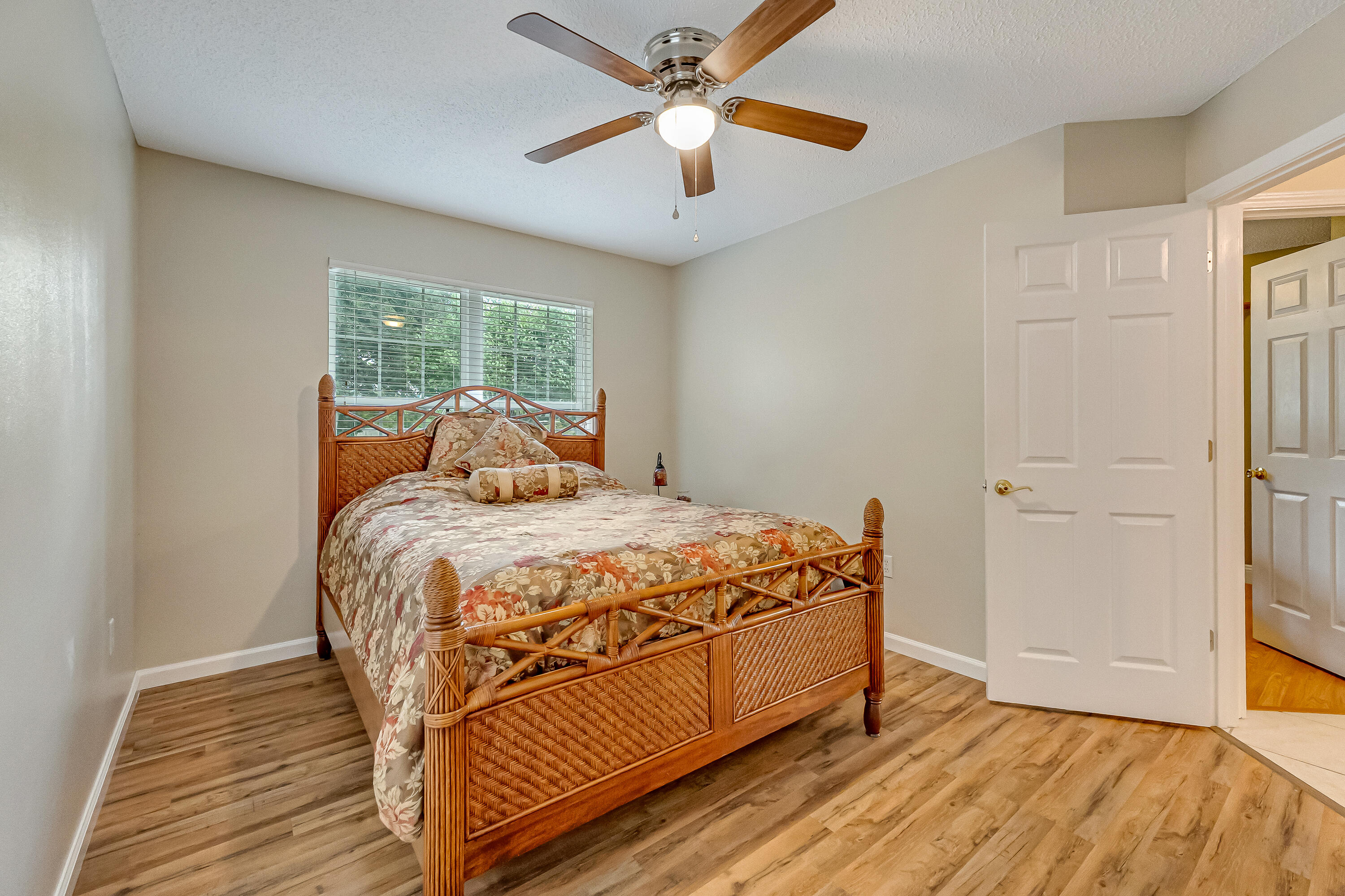 4730 Connor Drive Crestview, FL 32539 - Photo 43 of 71 a bedroom with a bed and a chandelier