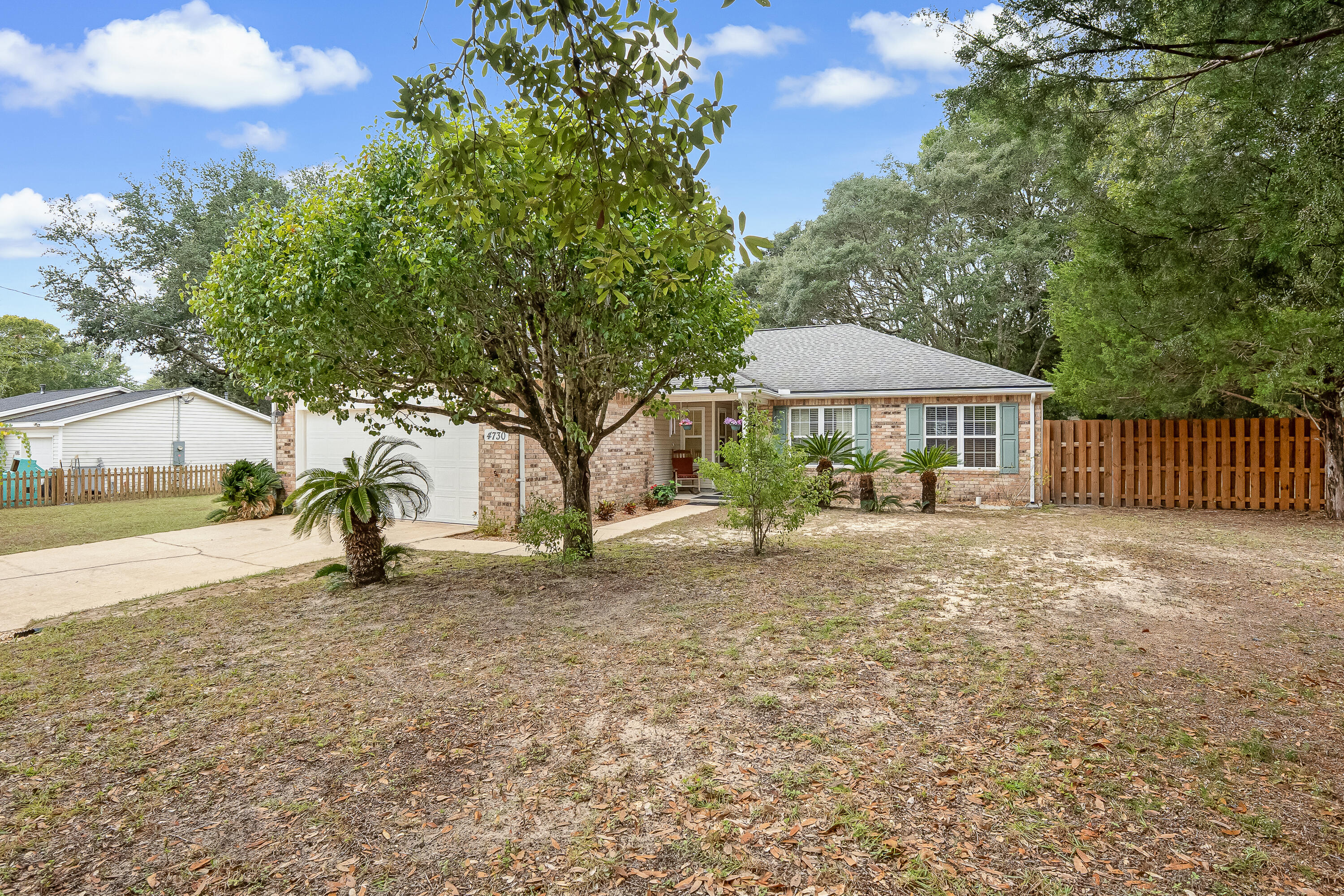 4730 Connor Drive Crestview, FL 32539 - Photo 5 of 71 a view of a house with a yard and sitting area