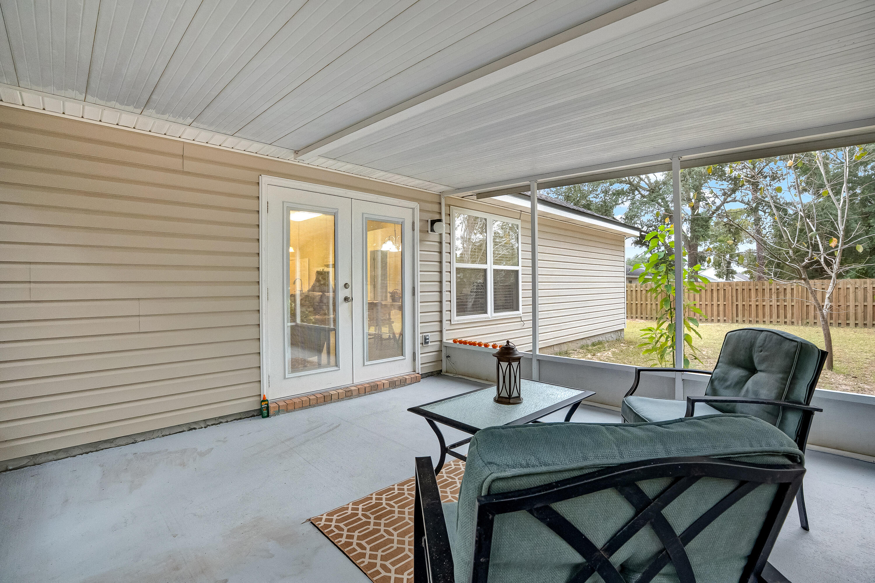 4730 Connor Drive Crestview, FL 32539 - Photo 54 of 71 a view of a dining room with furniture and wooden floor