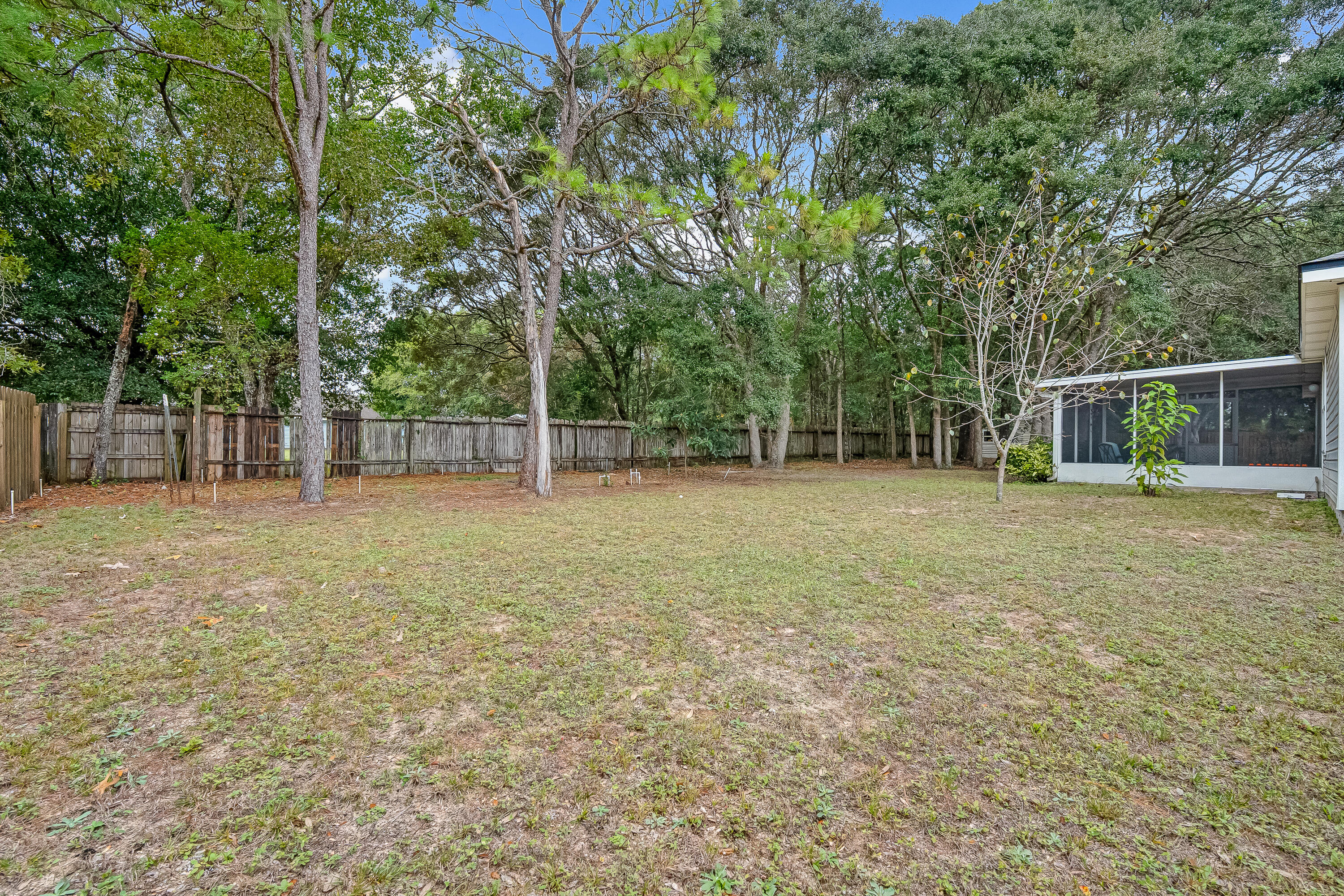 4730 Connor Drive Crestview, FL 32539 - Photo 63 of 71 a backyard of a house with lots of green space