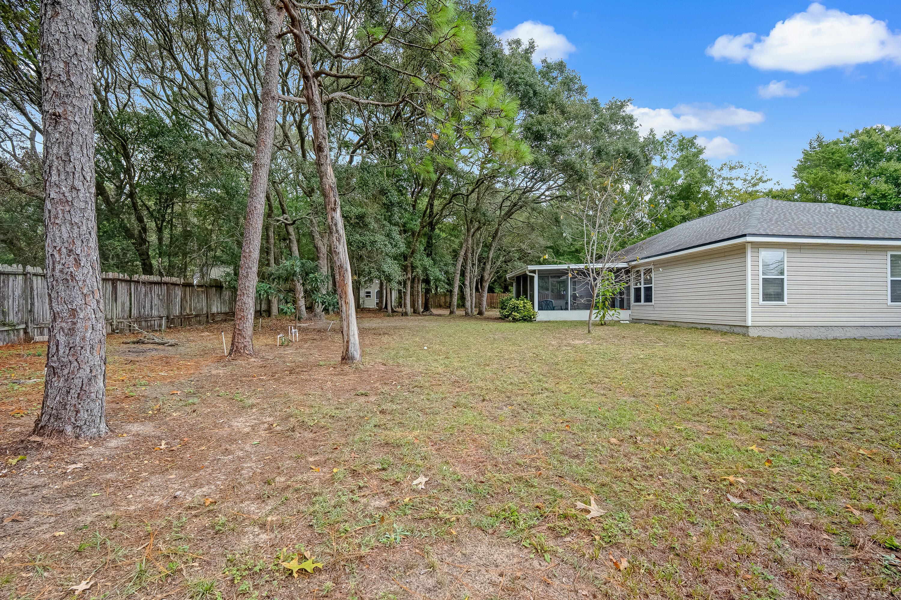 4730 Connor Drive Crestview, FL 32539 - Photo 64 of 71 a backyard of a house with lots of green space