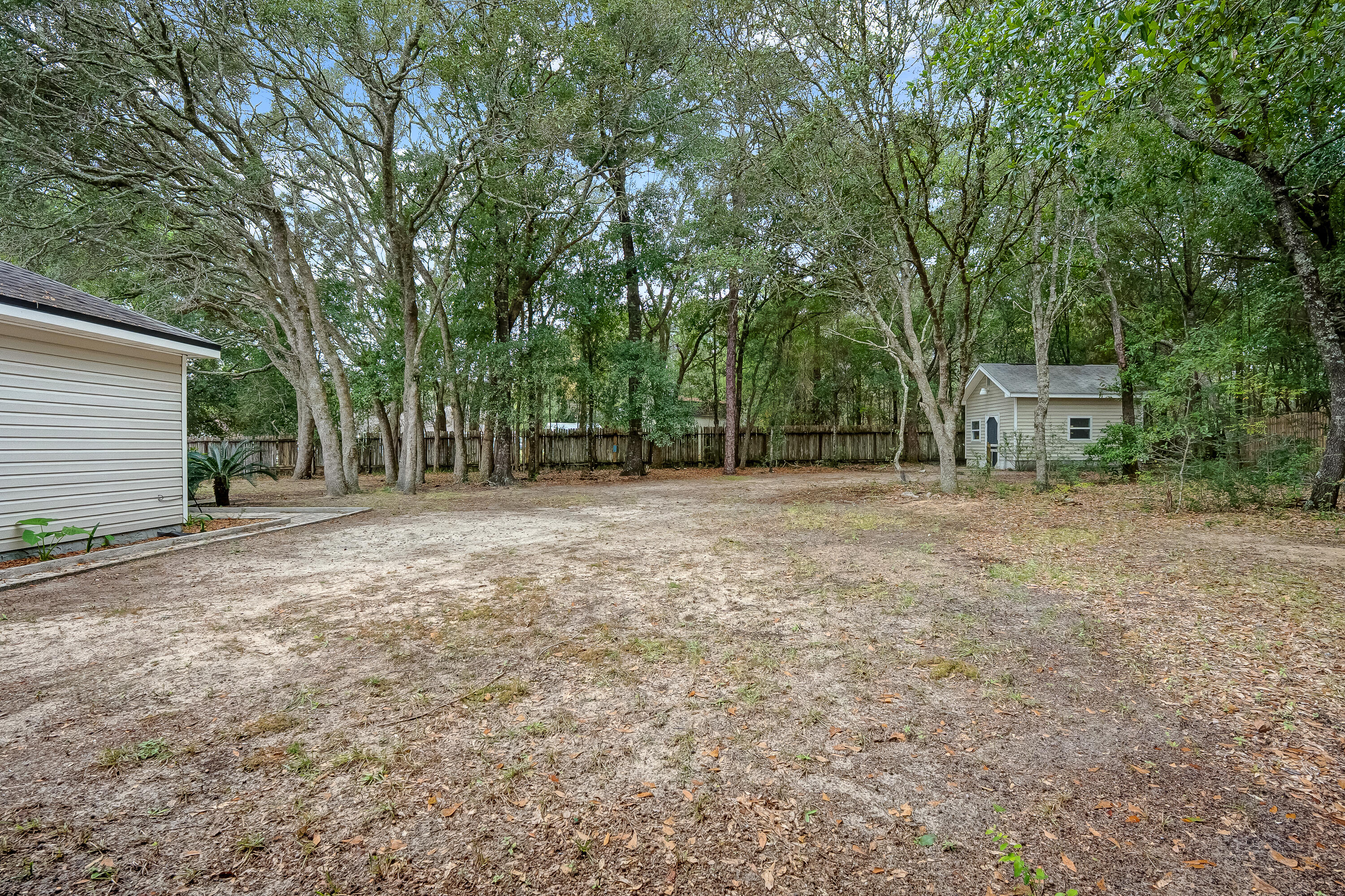 4730 Connor Drive Crestview, FL 32539 - Photo 68 of 71 a backyard of a house with shaded area