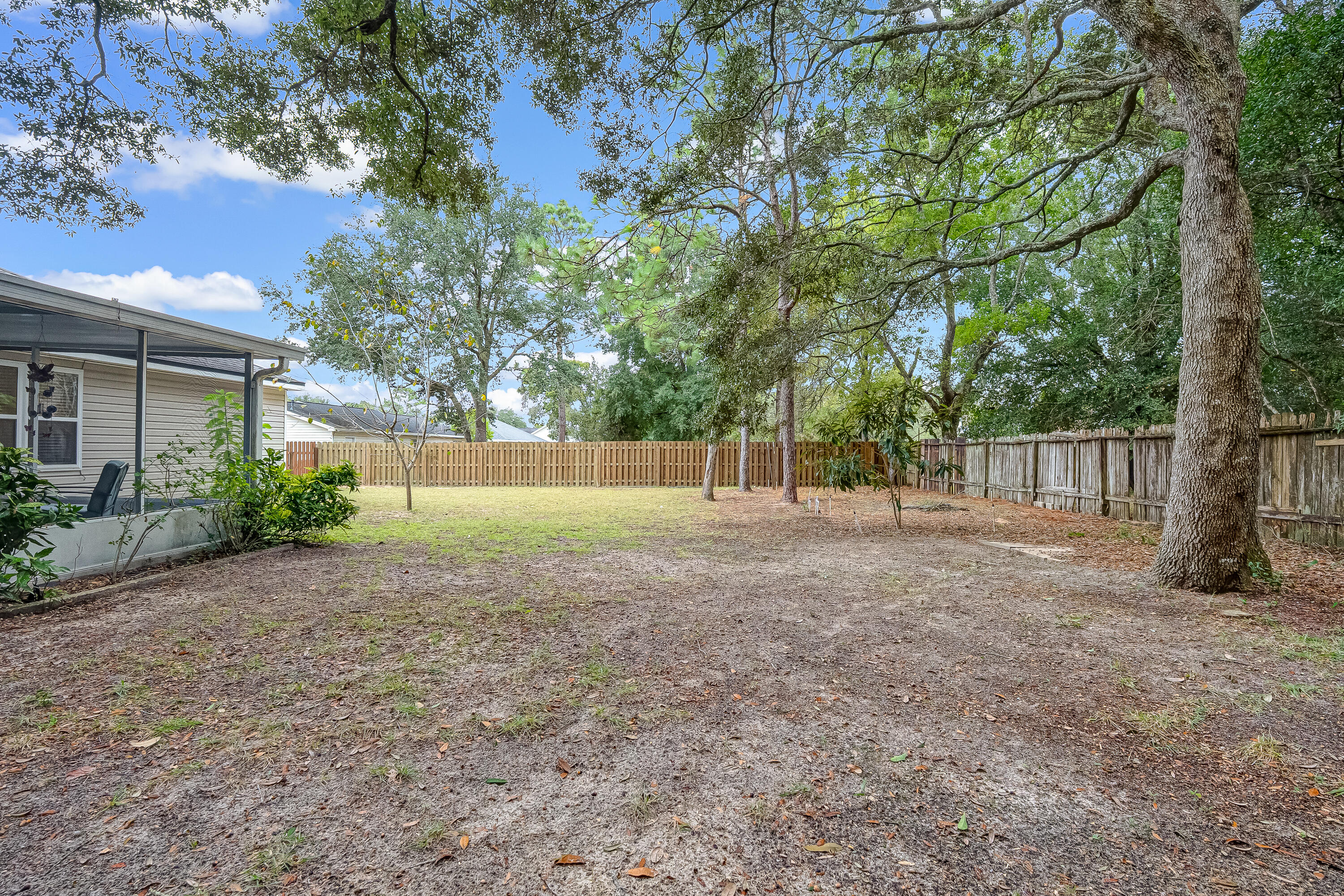 4730 Connor Drive Crestview, FL 32539 - Photo 70 of 71 a view of a yard with tree s