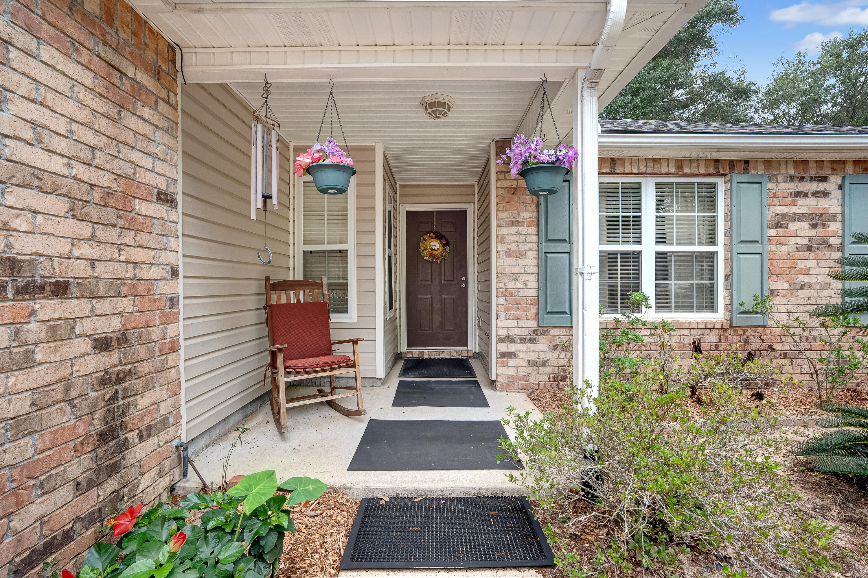 4730 Connor Drive Crestview, FL 32539 - Photo 7 of 71 a front view of a house with a porch