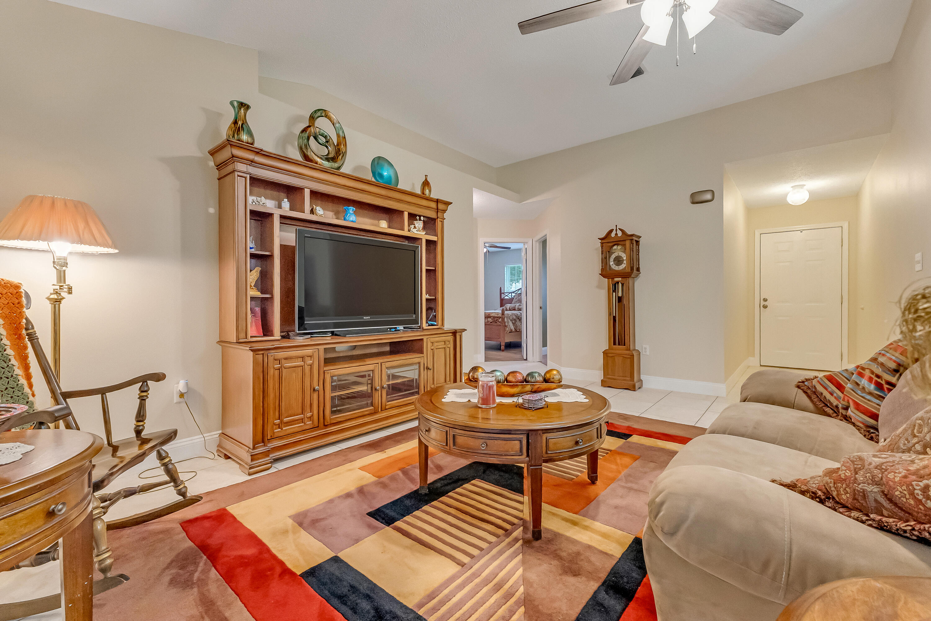 4730 Connor Drive Crestview, FL 32539 - Photo 10 of 71 a living room with furniture and a flat screen tv
