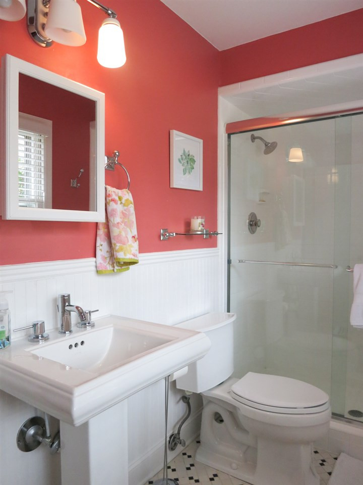 912 Hardimont Road Raleigh, NC 27609 - Photo 16 of 25 The adjacent renovated full Bath offers a tile flr, bead board wainscot, pedestal sink & lg shower w/newer glass doors. Nearby is the Laundry Rm w/neutral vinyl flr & shelving. Lower Level Full Bath