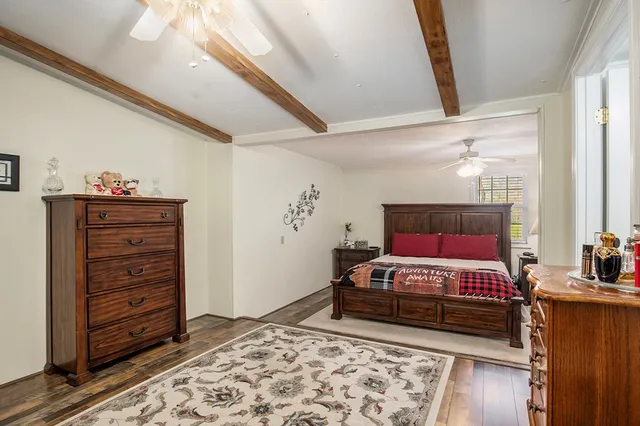 a bedroom with a bed and a dresser
