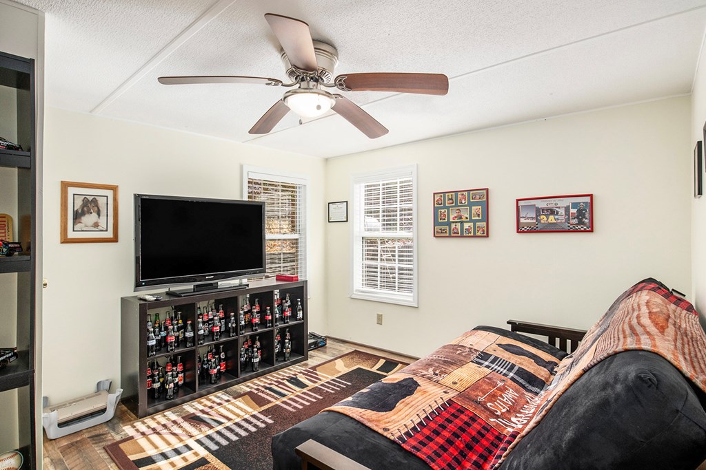 2226 Layson Road Hiawassee, GA 30546 - Photo 26 of 38 a bedroom with bed and a flat screen tv