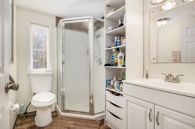a bathroom with a sink toilet and shower
