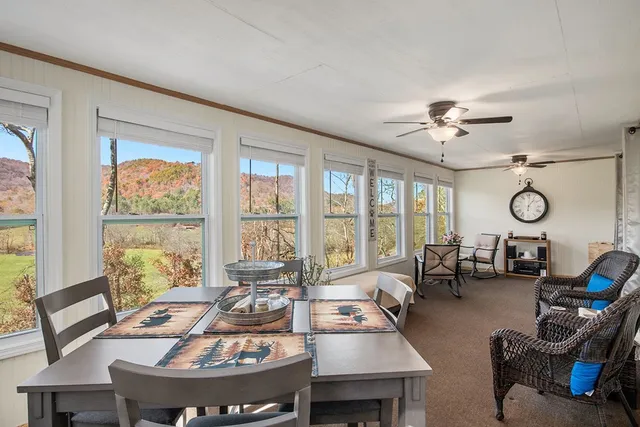 a view of a livingroom with furniture window and outside view