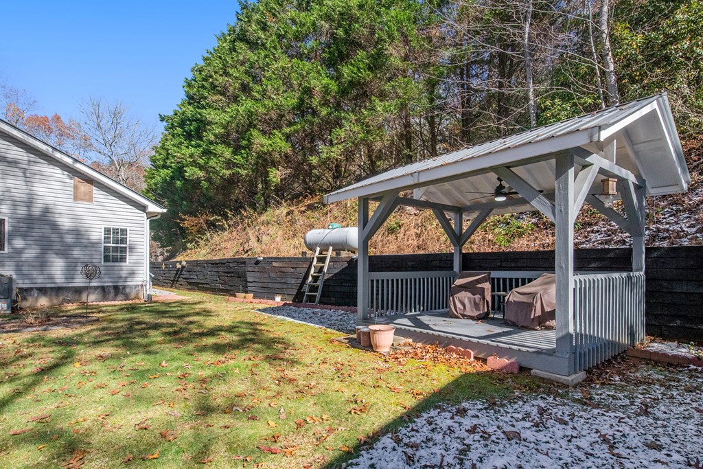2226 Layson Road Hiawassee, GA 30546 - Photo 34 of 38 a view of a patio with a table and chairs