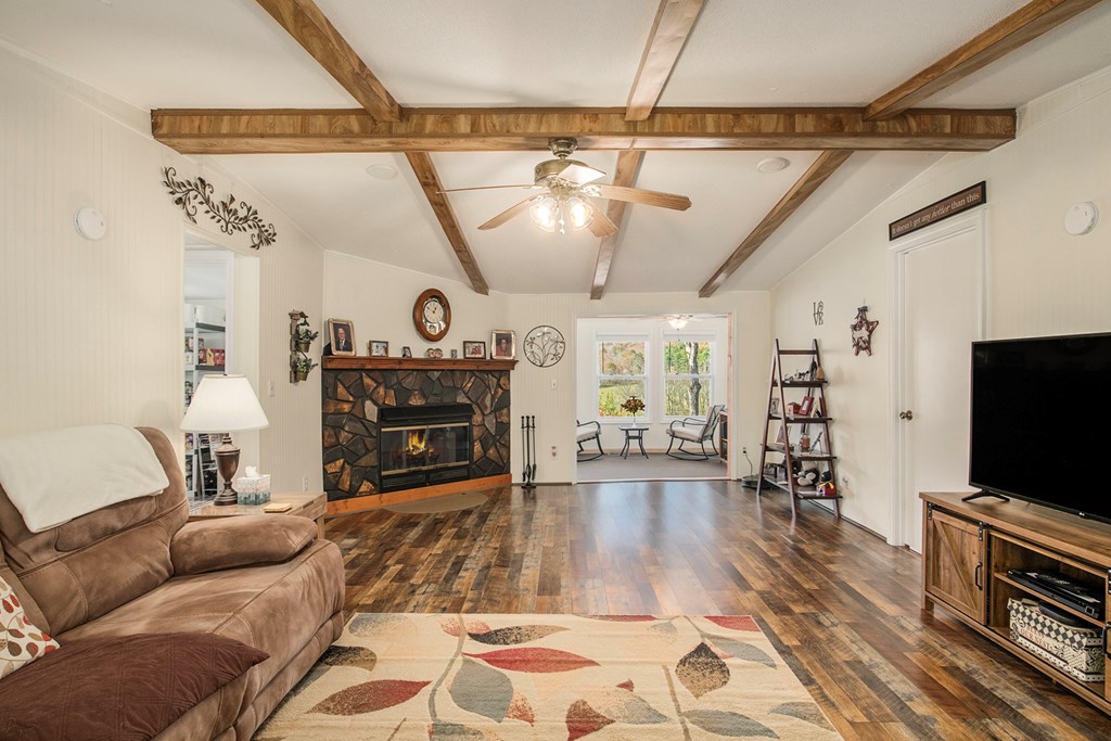2226 Layson Road Hiawassee, GA 30546 - Photo 7 of 38 a living room with furniture and a flat screen tv