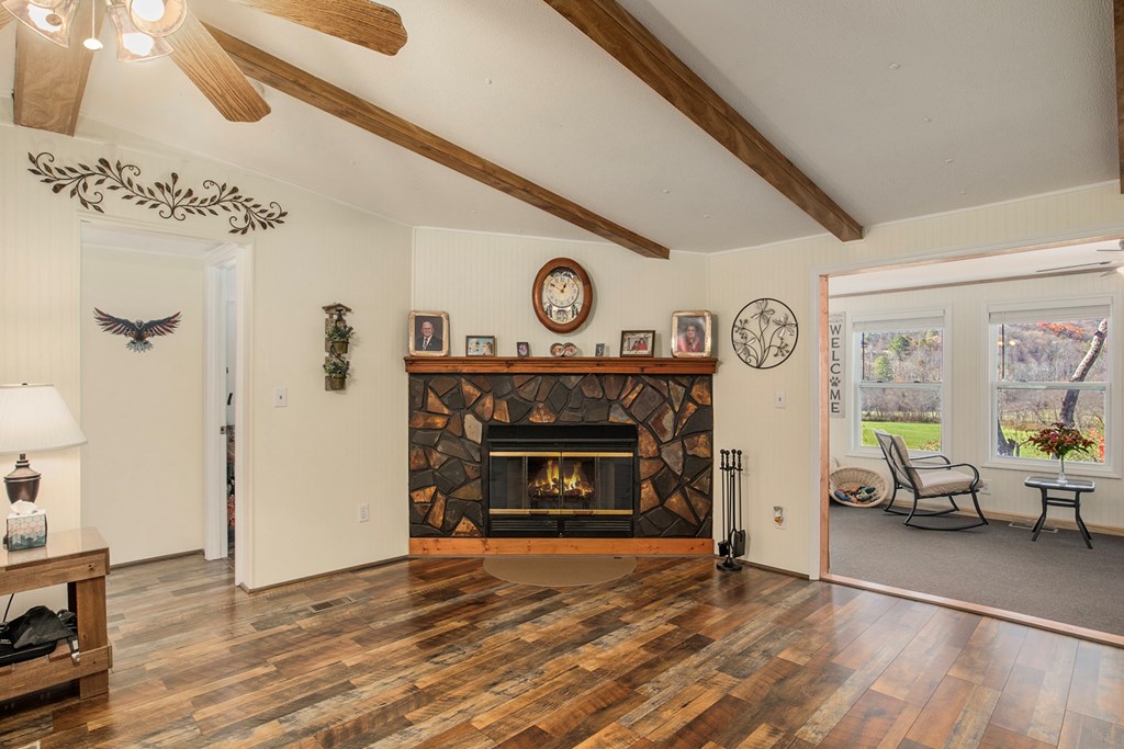 2226 Layson Road Hiawassee, GA 30546 - Photo 8 of 38 a living room with furniture and a fireplace