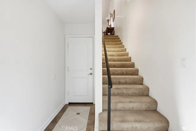 a living room with furniture and a book shelf