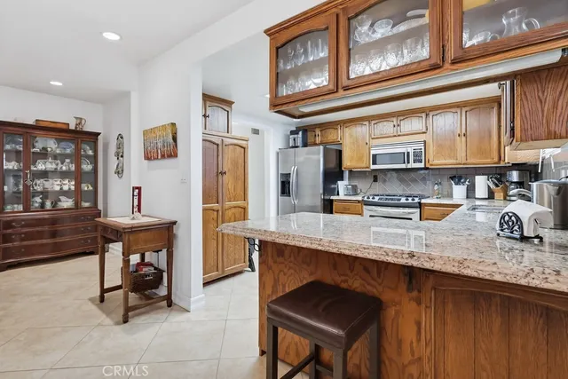 a view of a kitchen area with furniture and chandelier