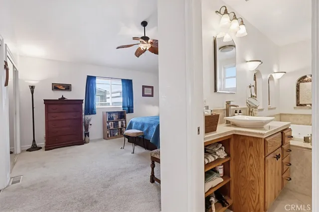 a bathroom with a toilet a sink and a mirror