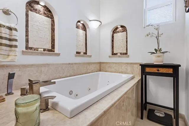 a view of a patio with table and chairs and potted plants