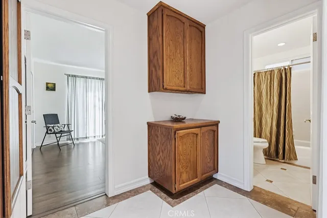 a bathroom with a sink a toilet and mirror
