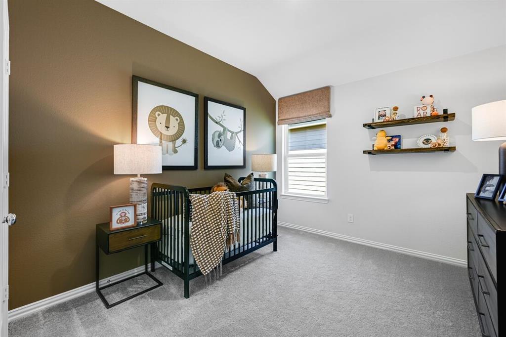 2621 Glacier Road Anna, TX 75409 - Photo 8 of 38 a room with toys and a baby crib