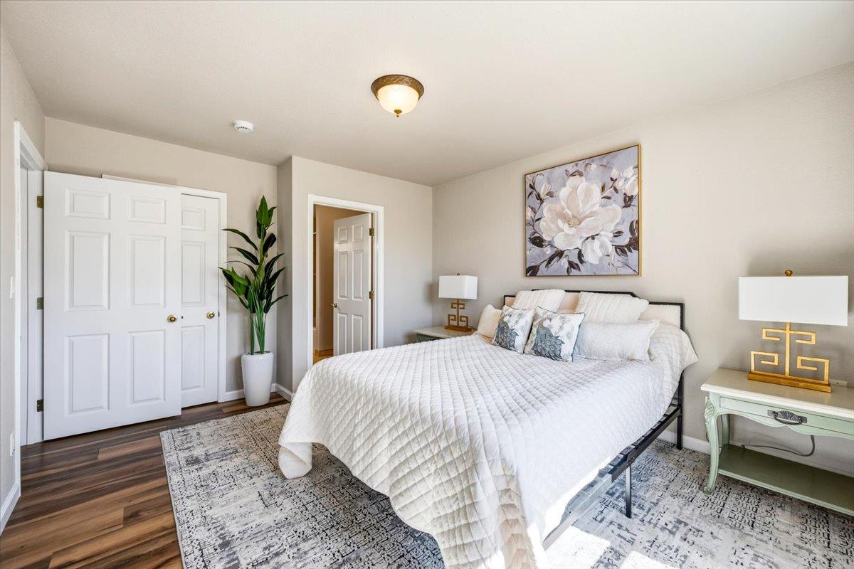 232 Upper Slate Creek Road Grass Valley, CA 95945 - Photo 19 of 48 a bedroom with a bed and a painting on the wall