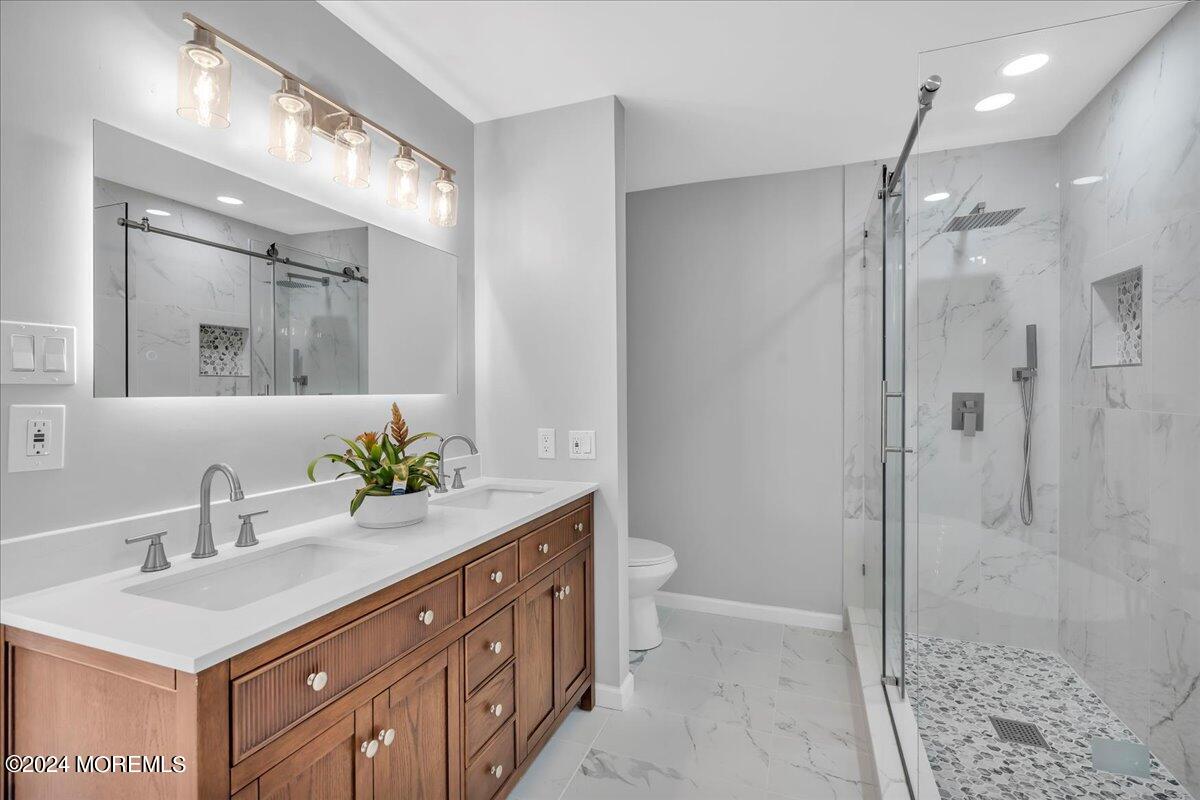 7701 Juniper Lane Palmyra, NJ 08065 - Photo 19 of 31 a bathroom with a sink a toilet and shower