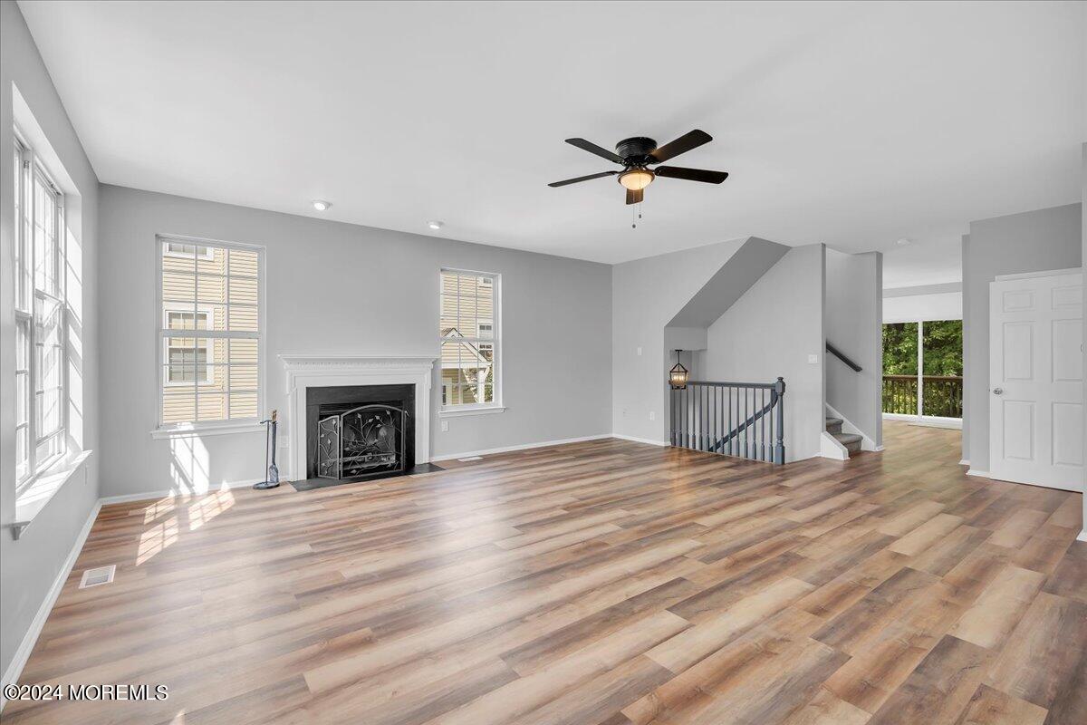7701 Juniper Lane Palmyra, NJ 08065 - Photo 6 of 31 a view of empty room with wooden floor and fireplace