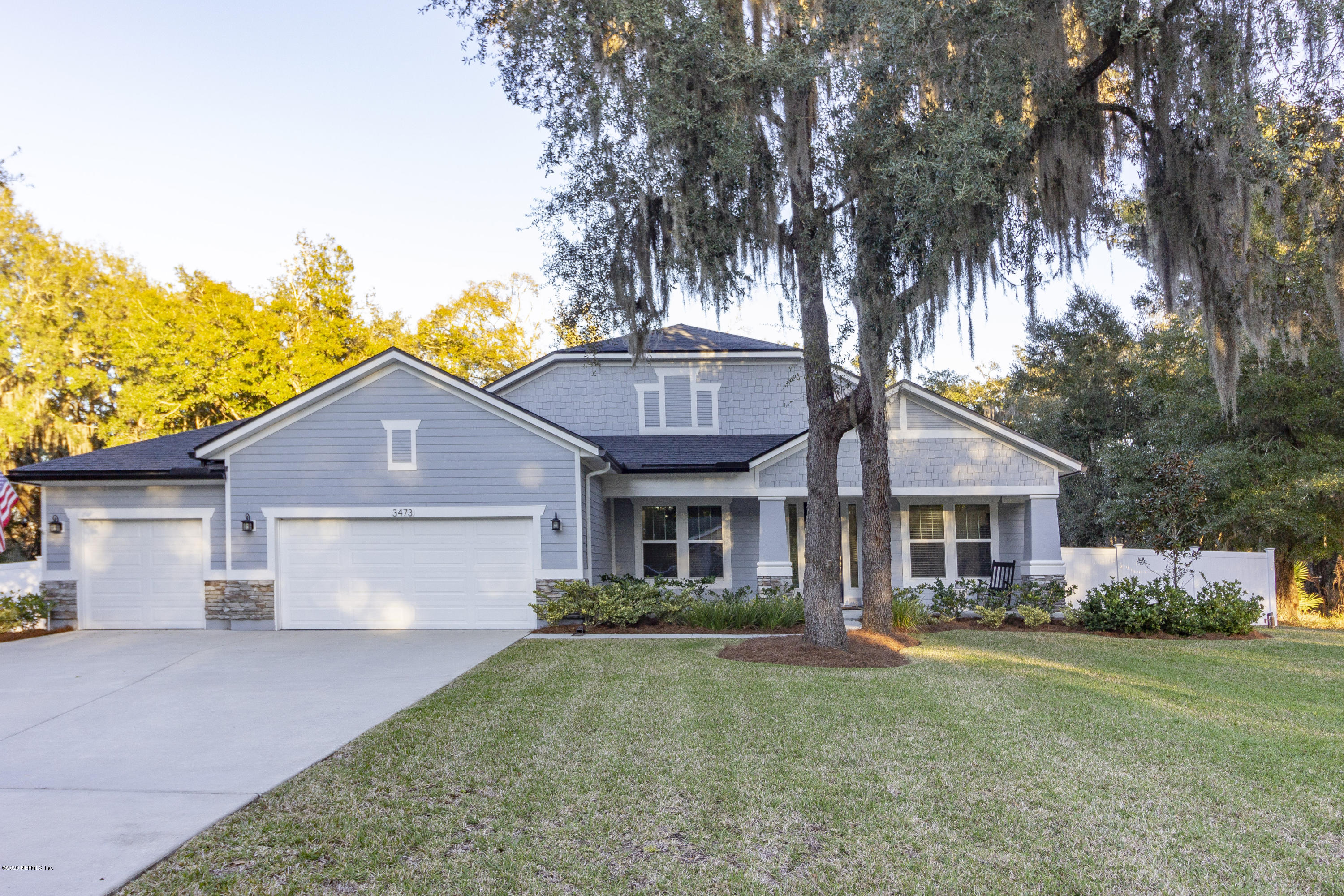 3473 Kings Road South St. Augustine, FL 32086 - Photo 54 of 56 a front view of a house with garden