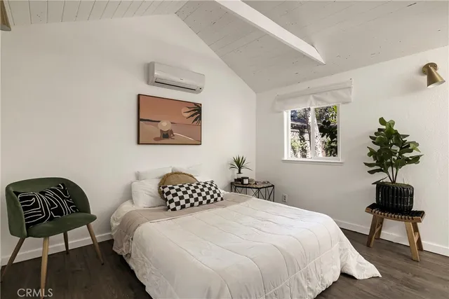 a bedroom with a bed and a chair