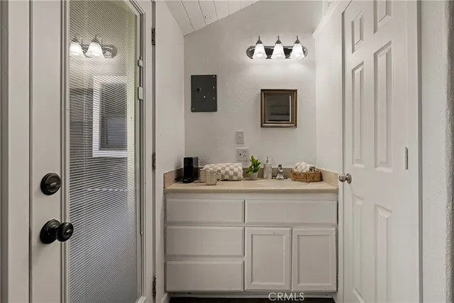a bathroom with a sink and mirror