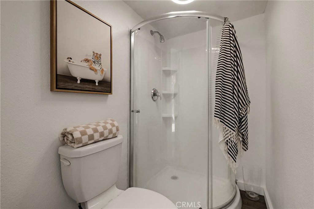 234 West 3rd Avenue Chico, CA 95926 - Photo 23 of 54 a bathroom with a toilet and a shower