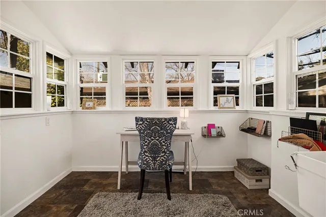 a room that has a dresser and a chair in it