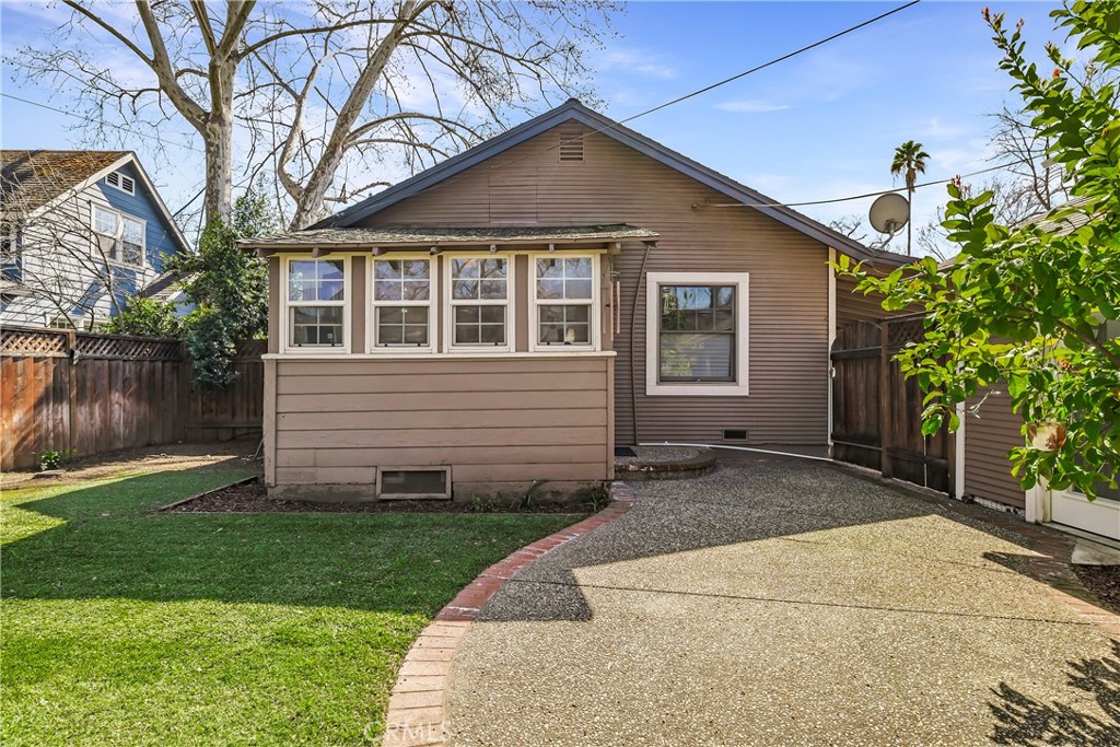 234 West 3rd Avenue Chico, CA 95926 - Photo 38 of 54 a front view of a house with a yard and trees