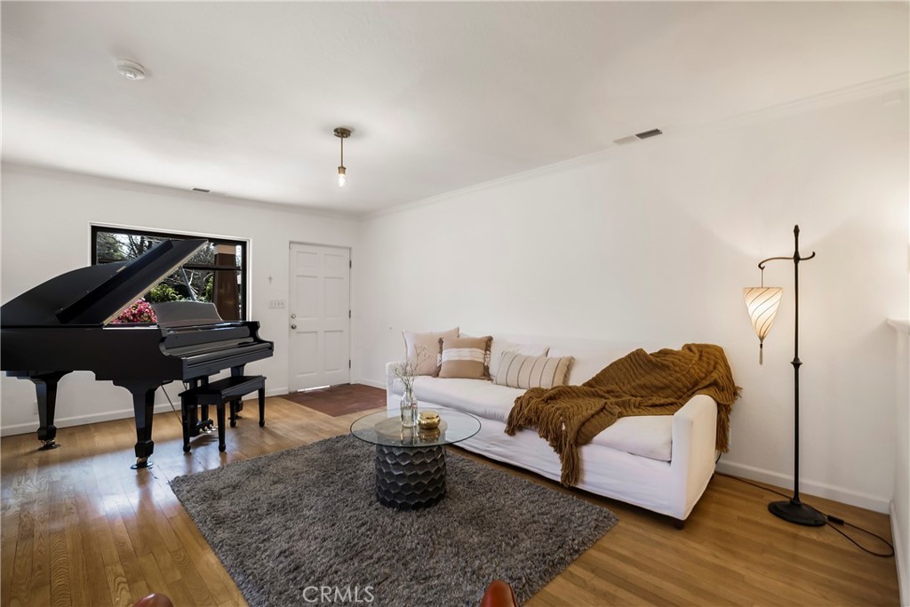 234 West 3rd Avenue Chico, CA 95926 - Photo 7 of 54 a living room with furniture and wooden floor