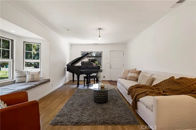 a living room with furniture rug and window