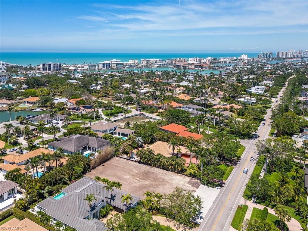 2331 Crayton Road Naples, FL 34103 - Photo 5 of 10 an aerial view of residential building and trees around
