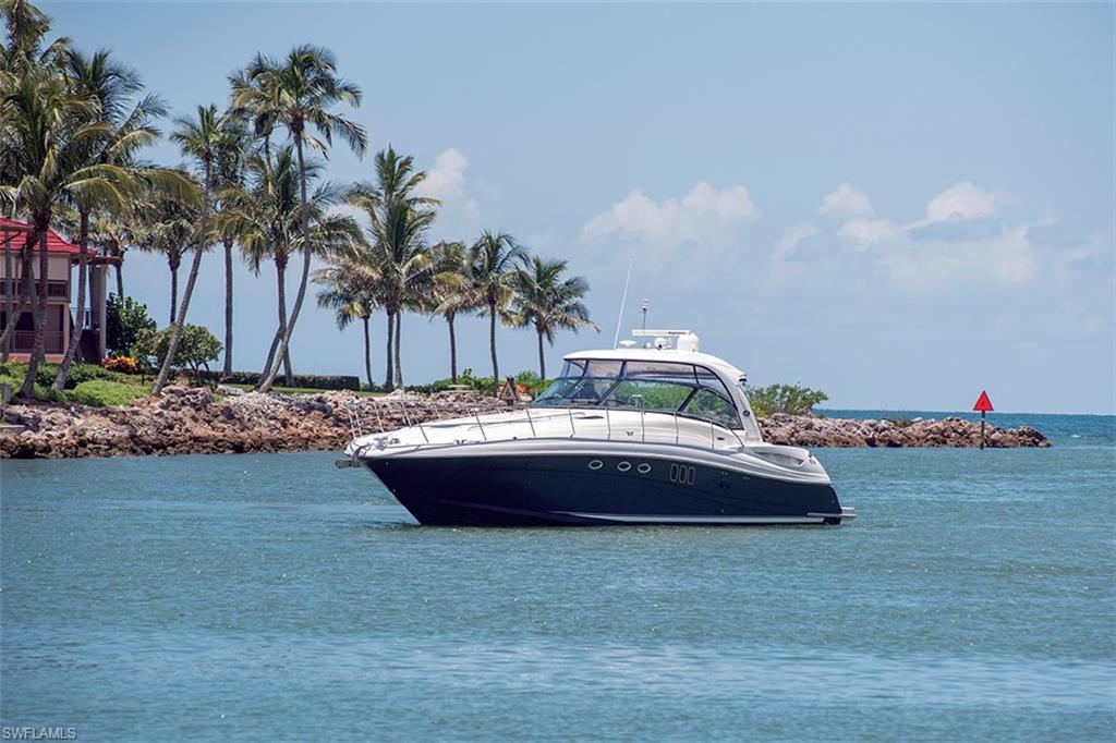 2331 Crayton Road Naples, FL 34103 - Photo 7 of 10 a view of swimming pool with a table and chairs