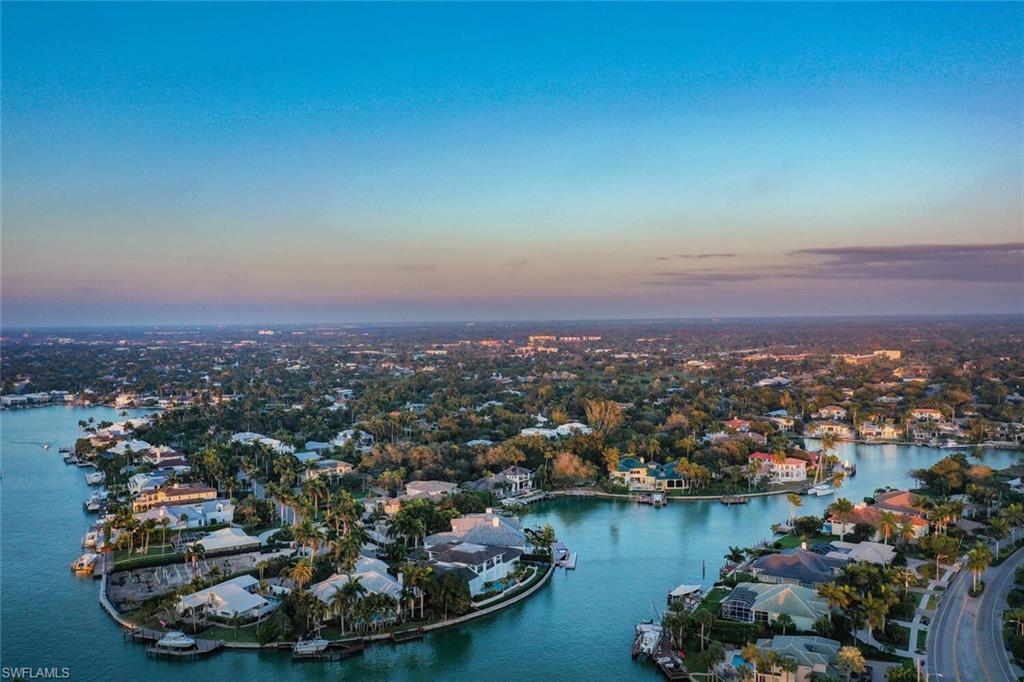 2331 Crayton Road Naples, FL 34103 - Photo 8 of 10 an aerial view of a house with a lake view